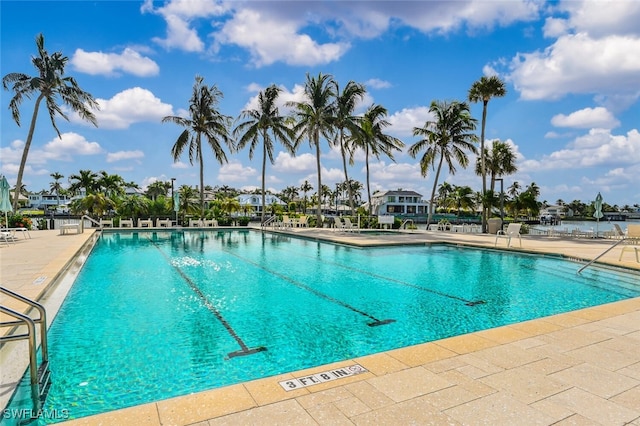 view of swimming pool with a patio