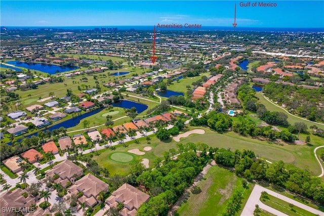aerial view featuring a water view, a residential view, and view of golf course