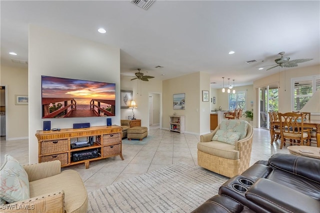 living area featuring recessed lighting, light tile patterned floors, visible vents, and a ceiling fan