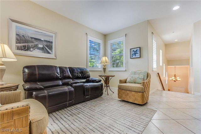 living room with an inviting chandelier, baseboards, tile patterned flooring, and recessed lighting