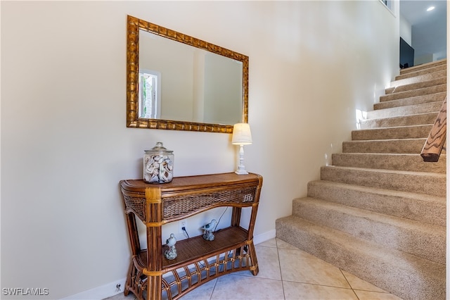 stairs featuring tile patterned floors