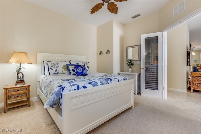 carpeted bedroom with ceiling fan and vaulted ceiling