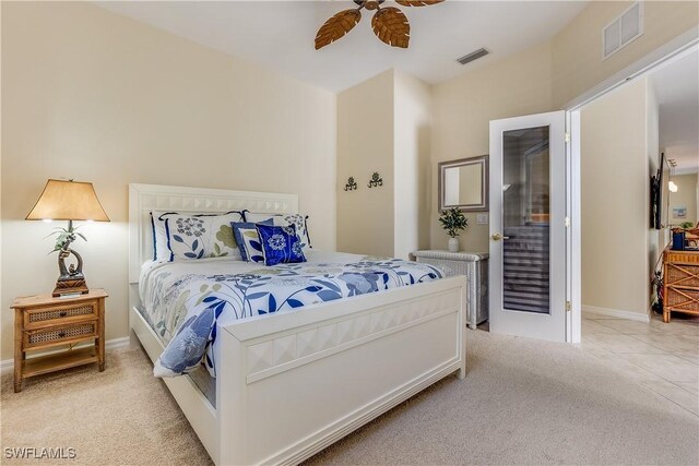 bedroom featuring light carpet, ceiling fan, and visible vents