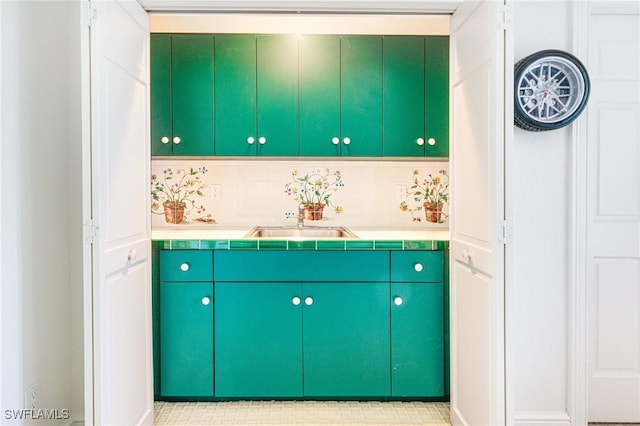 interior space with tasteful backsplash and sink