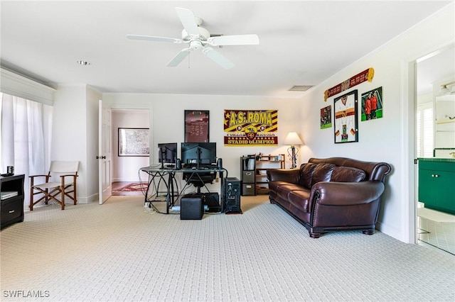 living room featuring carpet floors, a wealth of natural light, and ceiling fan