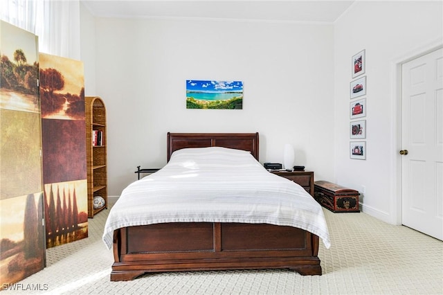 bedroom with light colored carpet