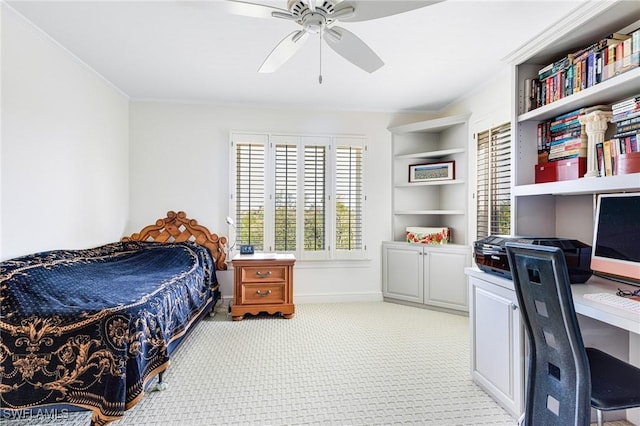 carpeted bedroom featuring ceiling fan and ornamental molding