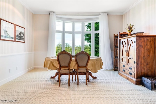 sitting room with light colored carpet and crown molding