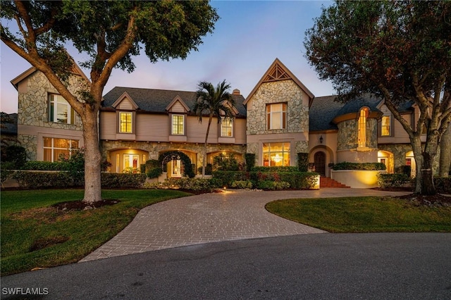 view of front of home with a lawn