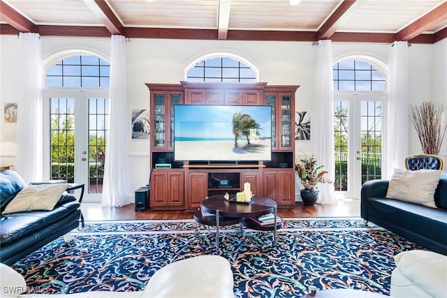 living room featuring plenty of natural light, wood ceiling, and french doors