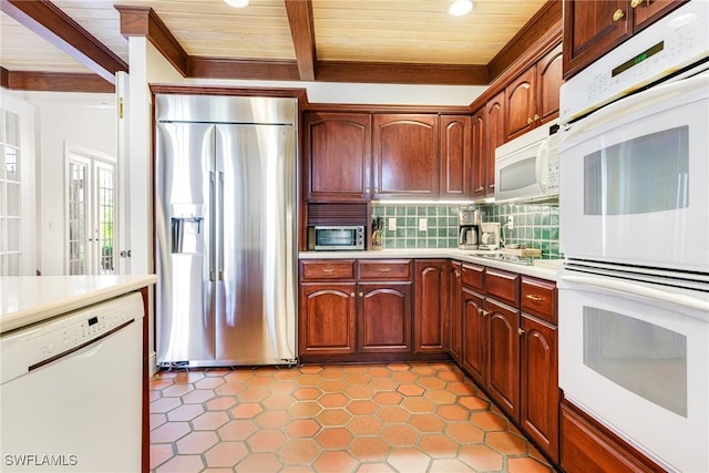 kitchen featuring beam ceiling, decorative backsplash, wood ceiling, and appliances with stainless steel finishes