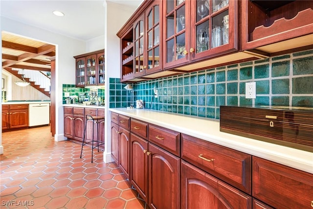 kitchen featuring tasteful backsplash, tile patterned flooring, white dishwasher, and beam ceiling