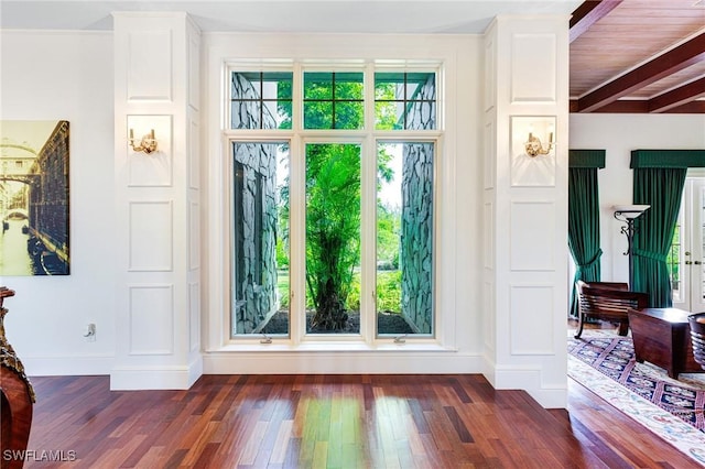 interior details featuring beamed ceiling, wood ceiling, and hardwood / wood-style floors