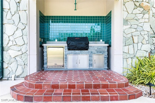 view of patio / terrace with an outdoor kitchen and grilling area