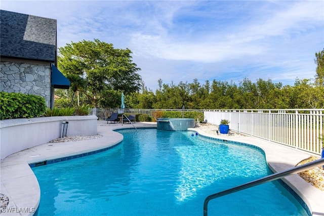 view of swimming pool featuring a patio area