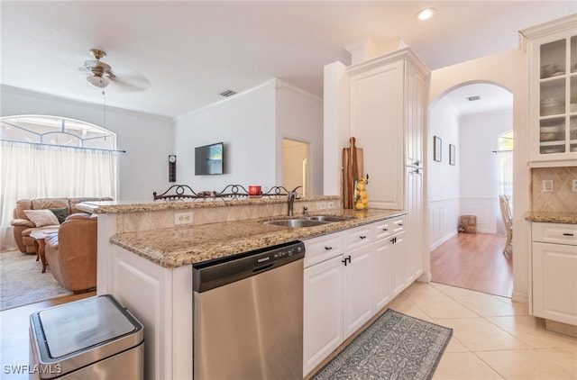 kitchen featuring white cabinets, sink, and dishwasher