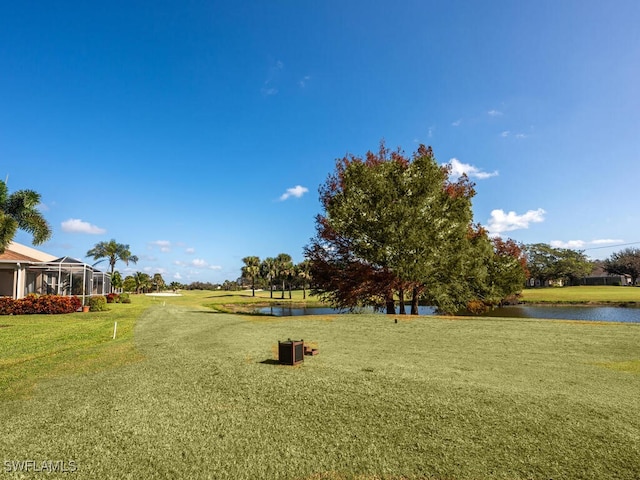 surrounding community featuring a yard and a water view