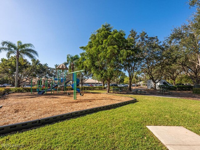 view of play area featuring a lawn