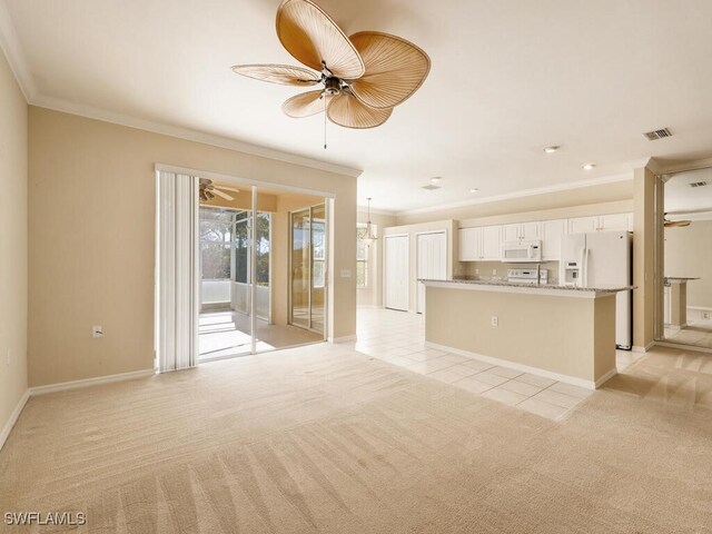 unfurnished living room with ceiling fan, crown molding, and light carpet