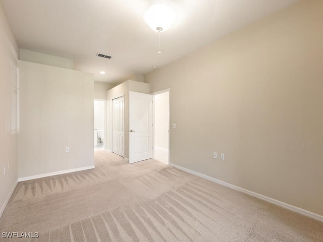 empty room with light carpet, baseboards, visible vents, and recessed lighting