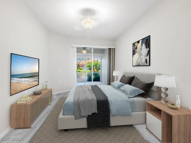 bedroom featuring access to outside, light wood-type flooring, and baseboards