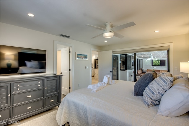 bedroom with ceiling fan, ensuite bath, and access to outside