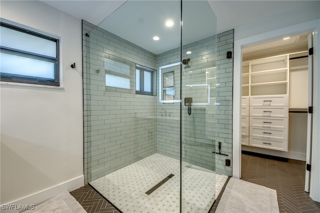 bathroom with walk in shower and a wealth of natural light