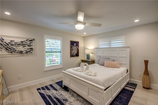 bedroom featuring light wood-type flooring and ceiling fan