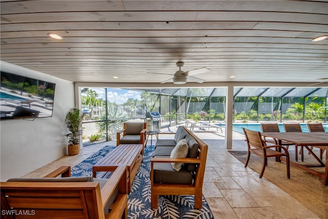 exterior space featuring ceiling fan, wood ceiling, and plenty of natural light