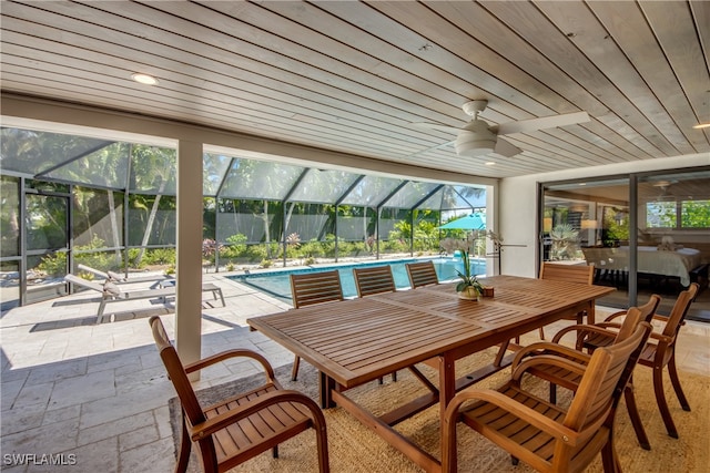 view of patio with a lanai and ceiling fan