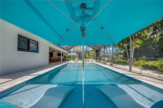 view of pool featuring a lanai and a patio area