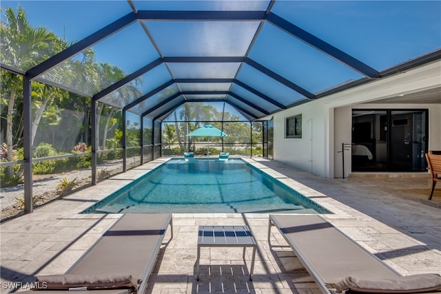 view of pool featuring a patio and a lanai