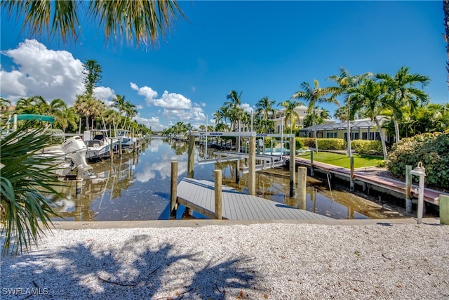 view of dock featuring a lanai and a water view