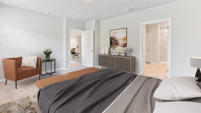 carpeted bedroom featuring ensuite bathroom