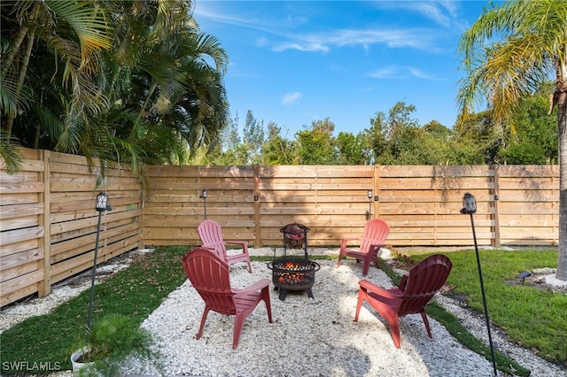 view of patio with an outdoor fire pit