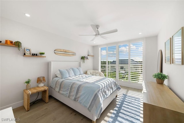 bedroom featuring baseboards, ceiling fan, recessed lighting, and wood finished floors