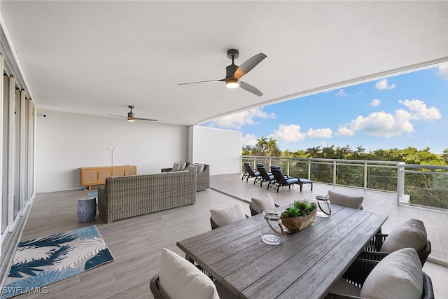 deck featuring an outdoor living space and ceiling fan