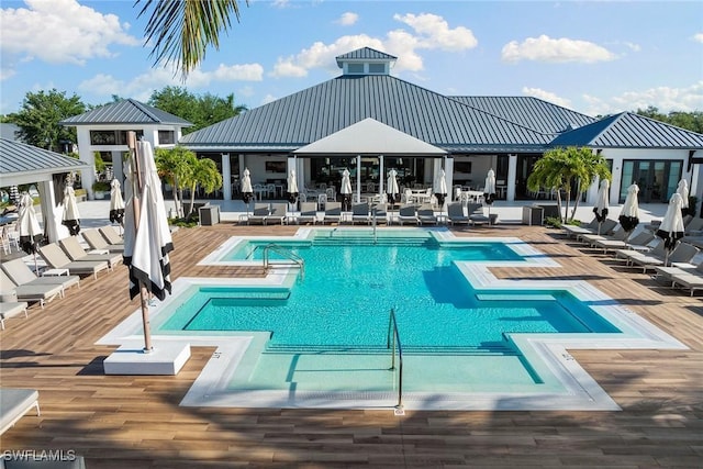 pool with a deck, a gazebo, french doors, and a patio area