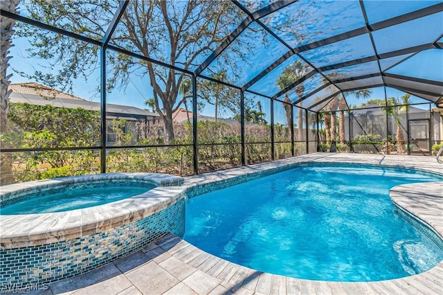 view of pool with an in ground hot tub and glass enclosure