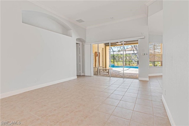 unfurnished living room featuring crown molding and light tile patterned floors