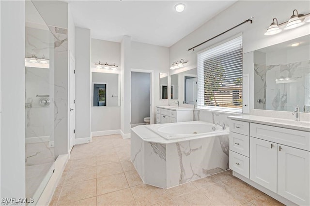 full bathroom with tile patterned floors, vanity, toilet, and shower with separate bathtub