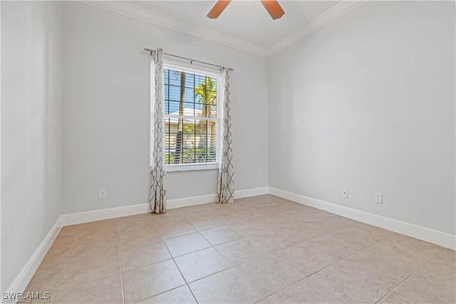 tiled spare room with ornamental molding and ceiling fan