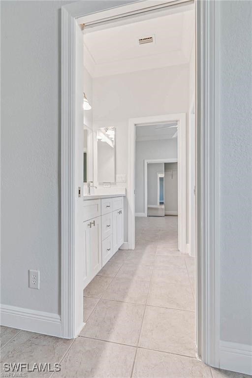 bathroom with tile patterned flooring and vanity