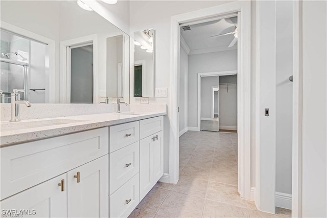 bathroom featuring ceiling fan, vanity, and tile patterned floors