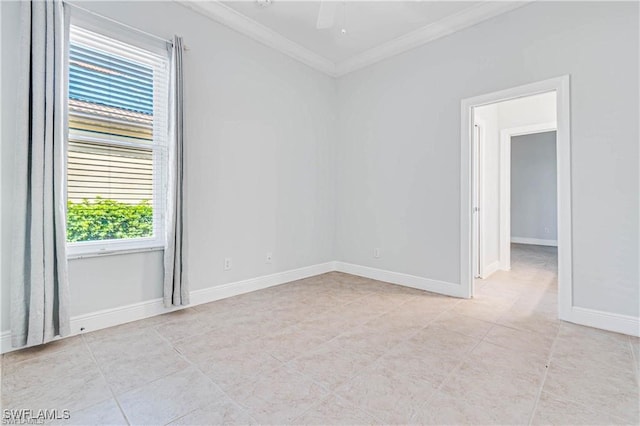 empty room featuring crown molding and ceiling fan