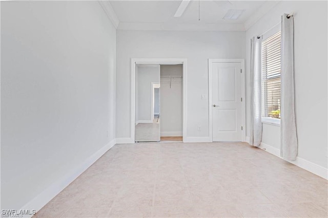 unfurnished bedroom featuring a closet, crown molding, and ceiling fan