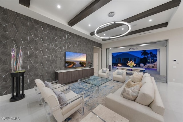 living room featuring beamed ceiling and tile walls