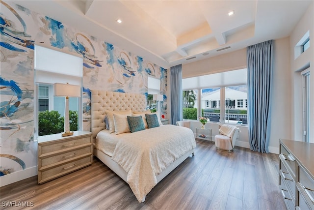 bedroom with multiple windows, coffered ceiling, and dark hardwood / wood-style floors