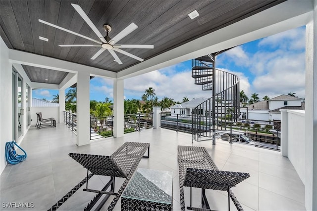 view of patio / terrace featuring a balcony and ceiling fan