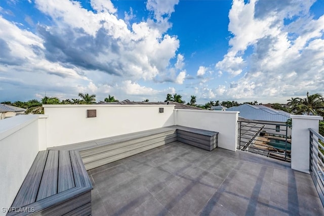 view of patio featuring a balcony